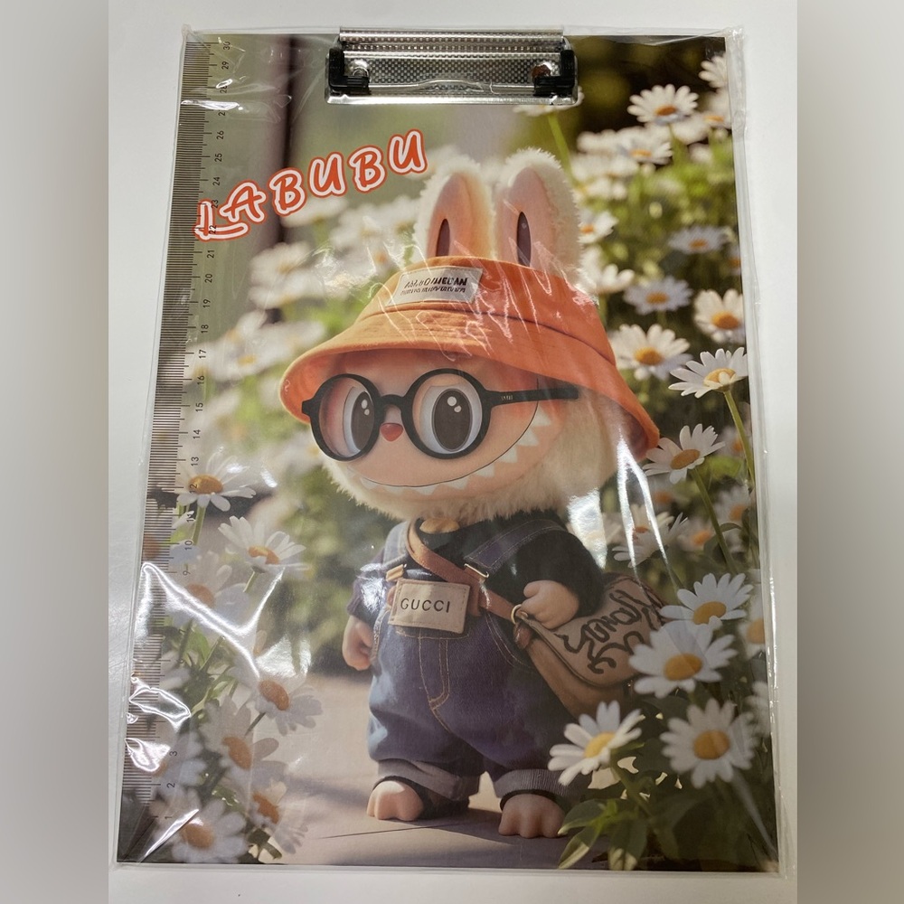 Labubu-themed clipboard folder with a built-in ruler on the left side.